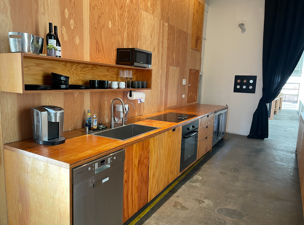A kitchen with wooden cabinets and stainless steel appliances