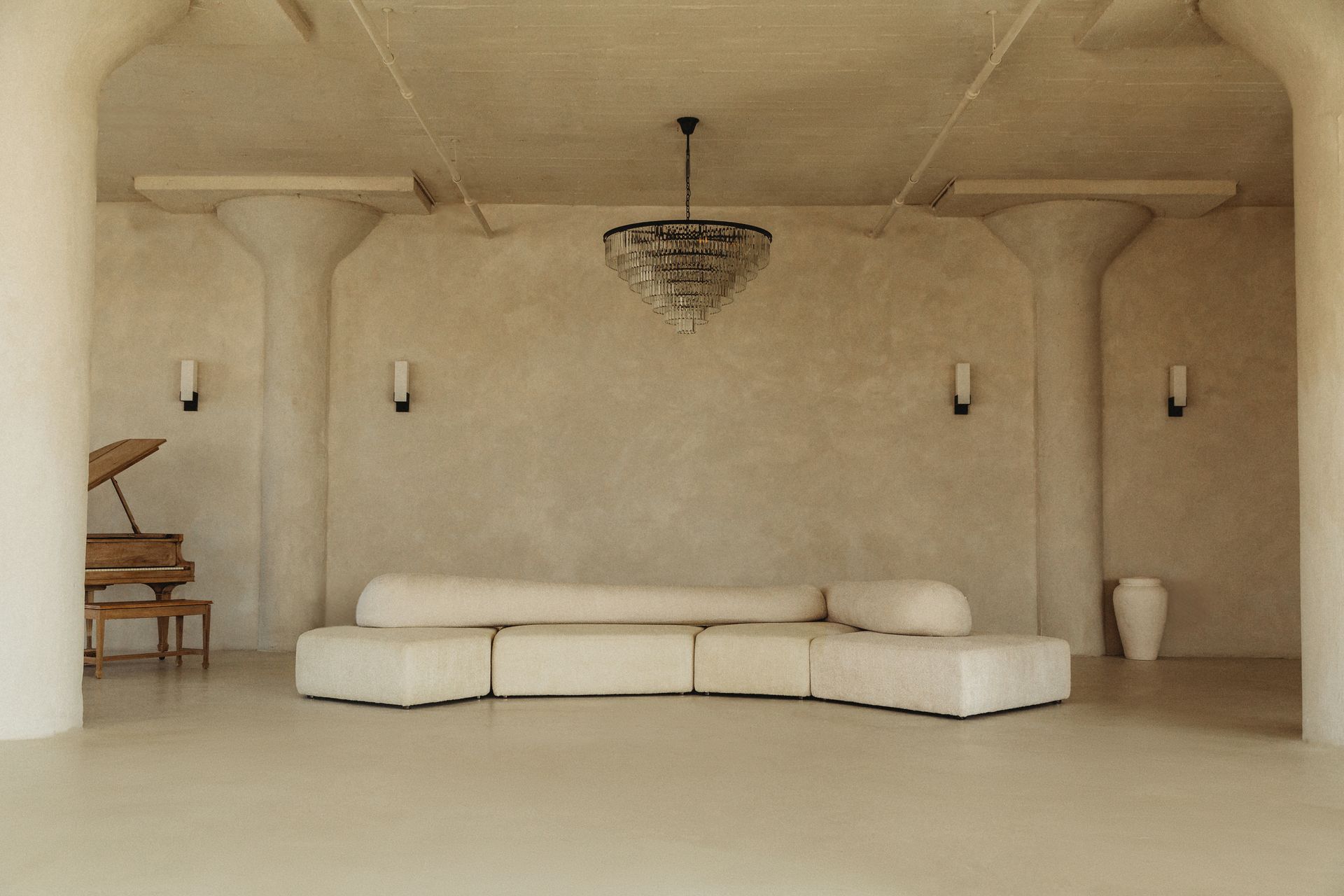 A living room with a piano and a couch