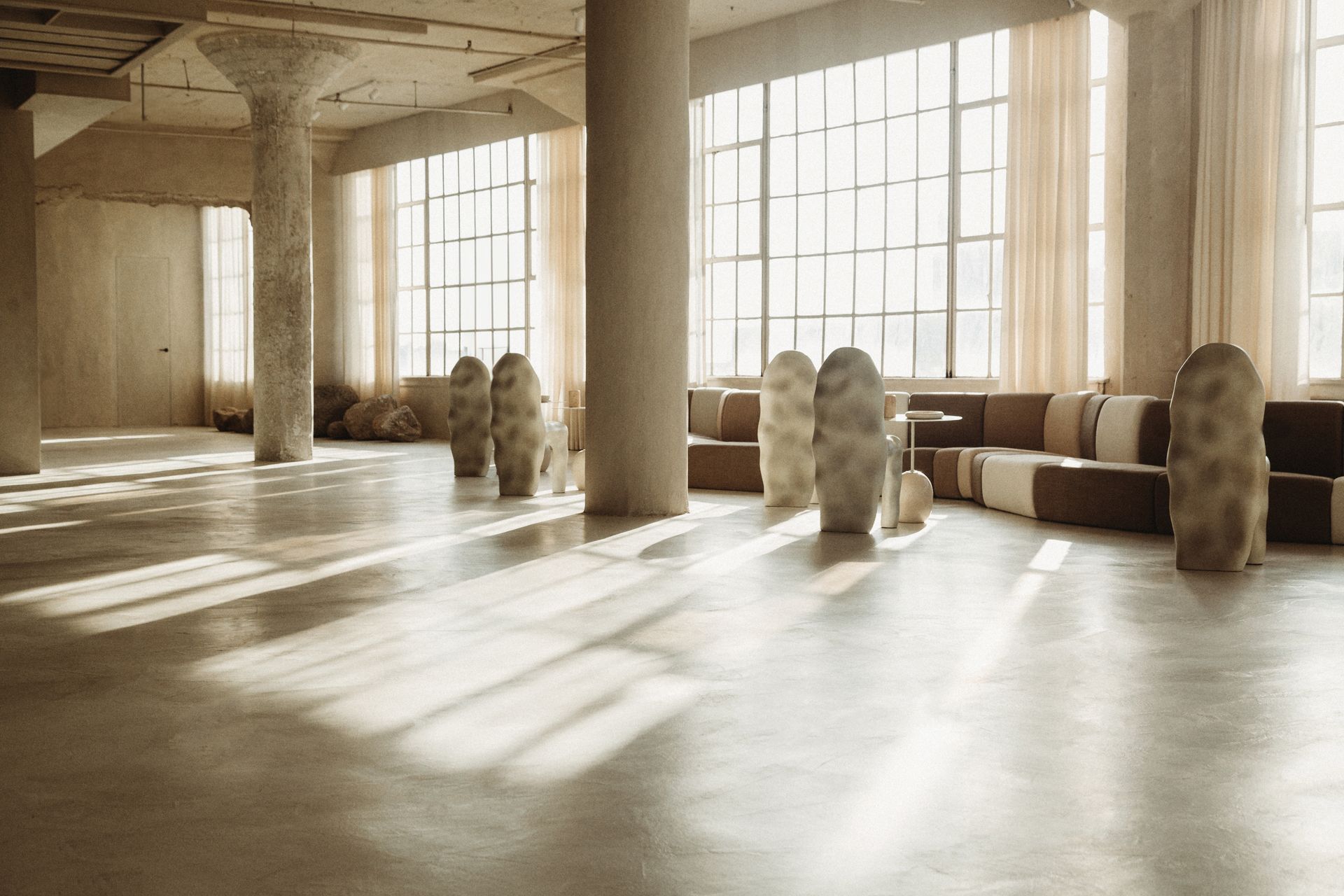 A large room with a lot of windows and columns