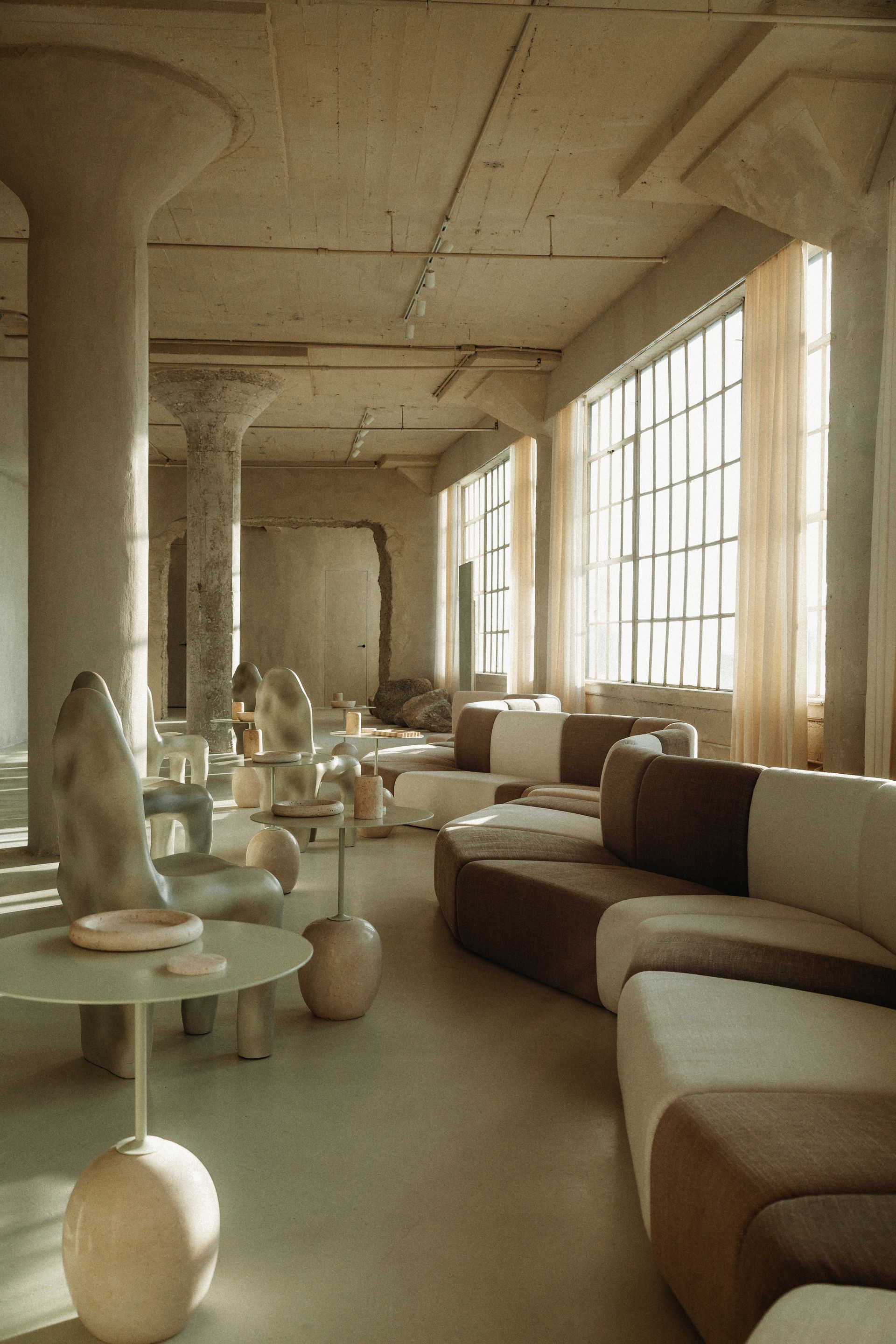 A living room with a lot of furniture and a table