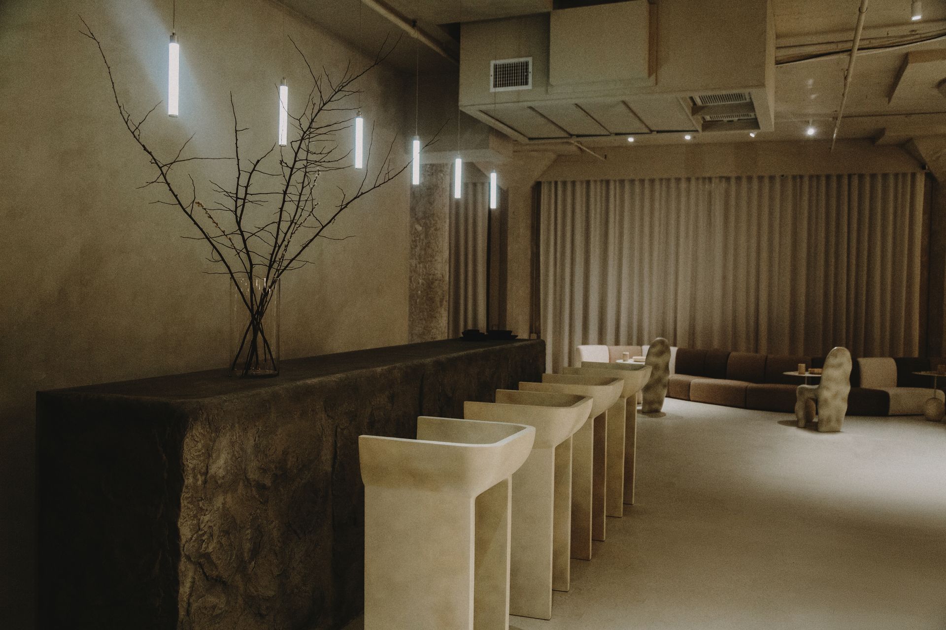 A room with a lot of tables and chairs in it