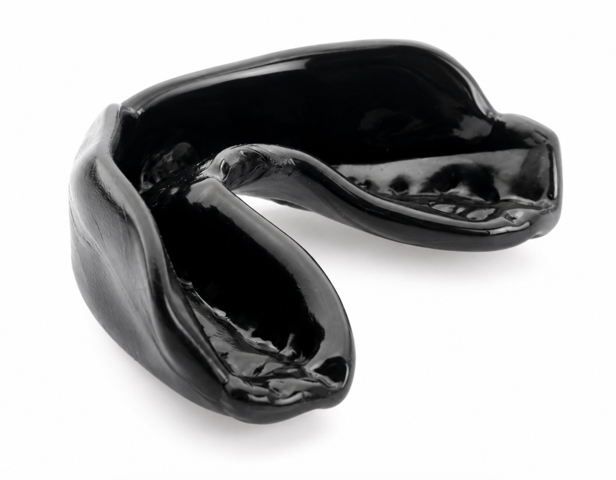 Black mouth guard or bite splint with a U-shaped opening, shown on a white background
