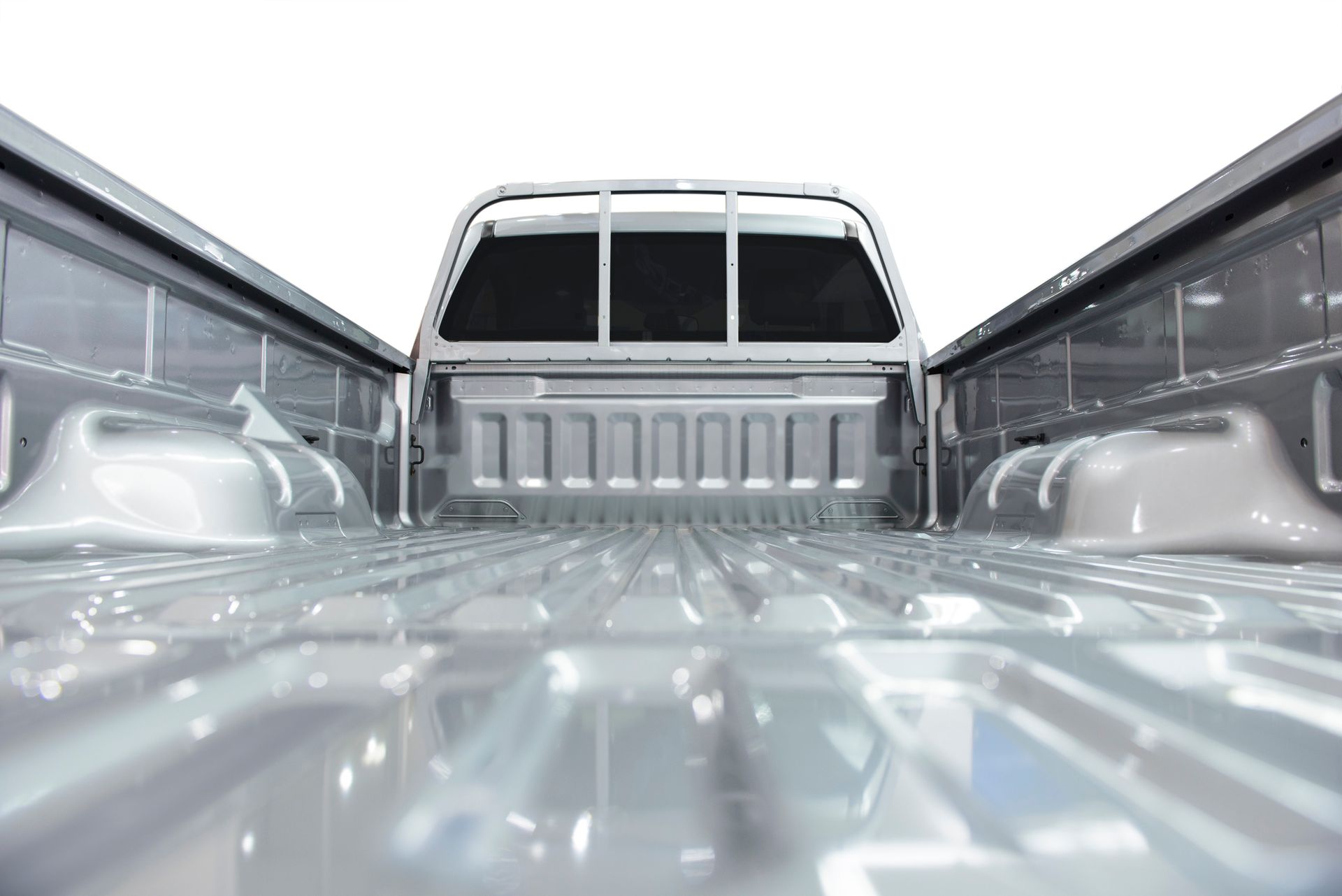 A close up of the back of an empty truck on a white background.