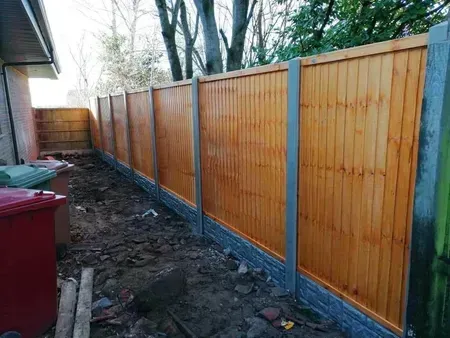 Wooden fence installation with concrete posts in Hessle