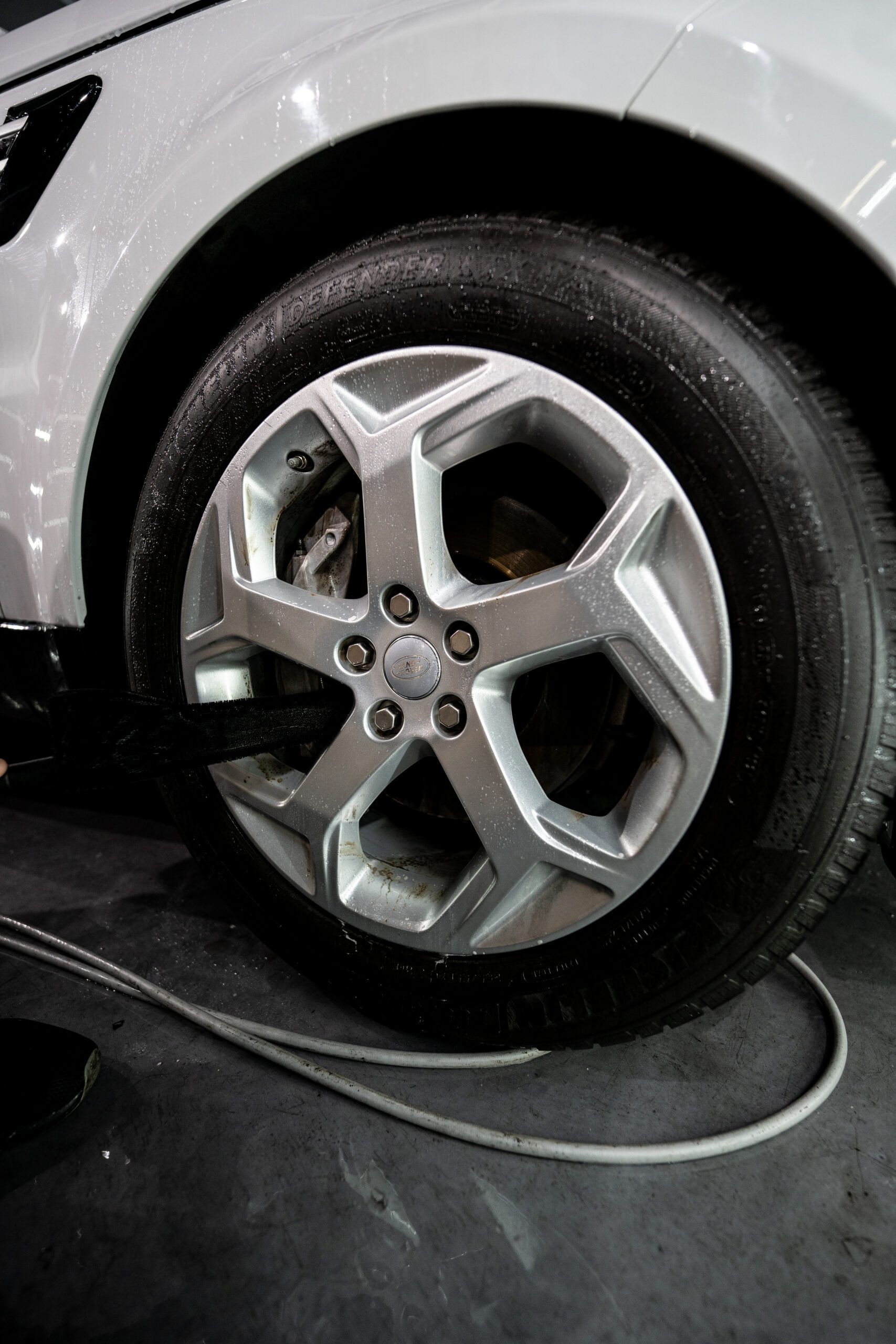 A close up of a car wheel with a tire on it.