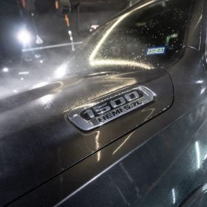 A close up of the hood of a dodge ram 1500 truck.