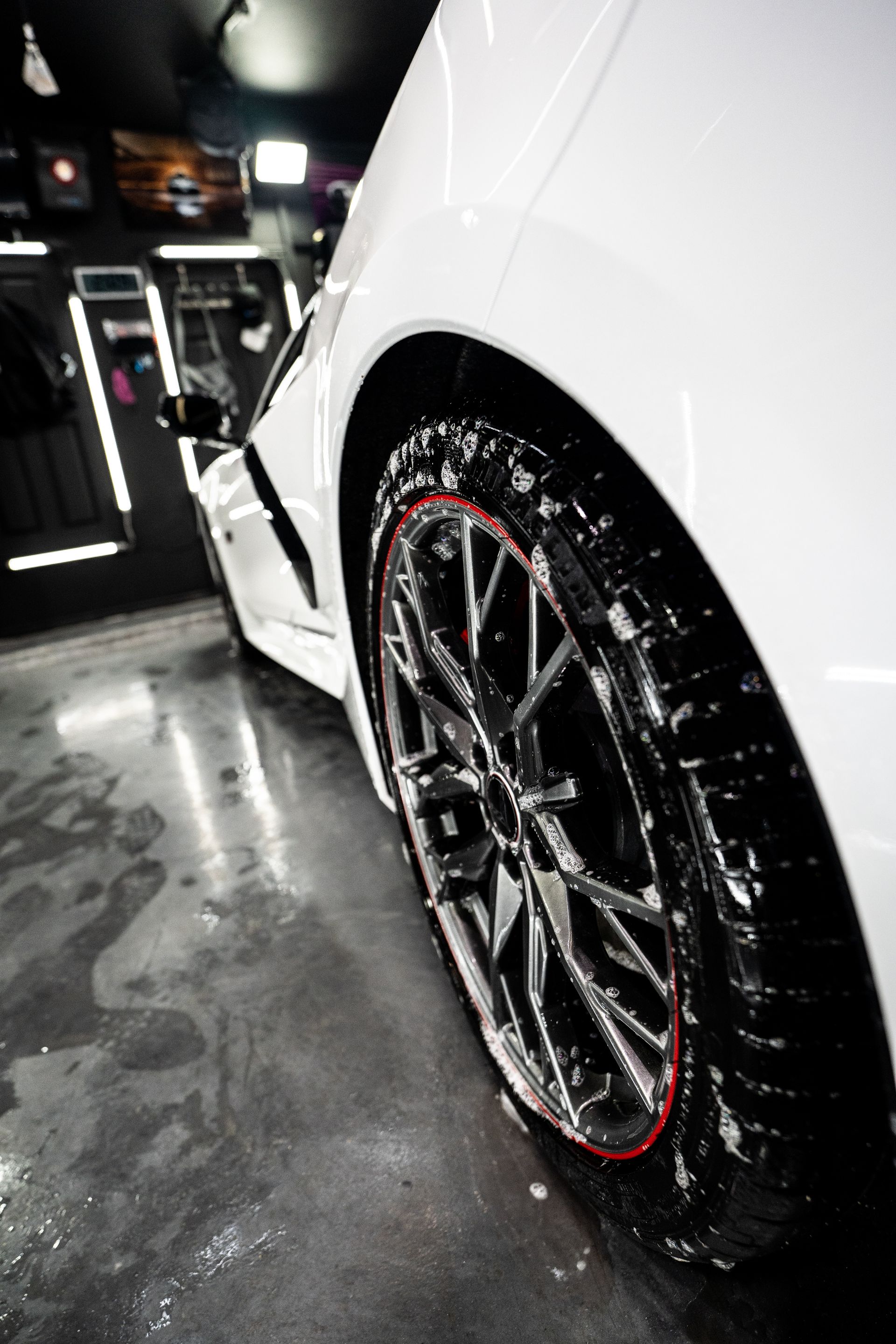 A close up of a car wheel with soap on it