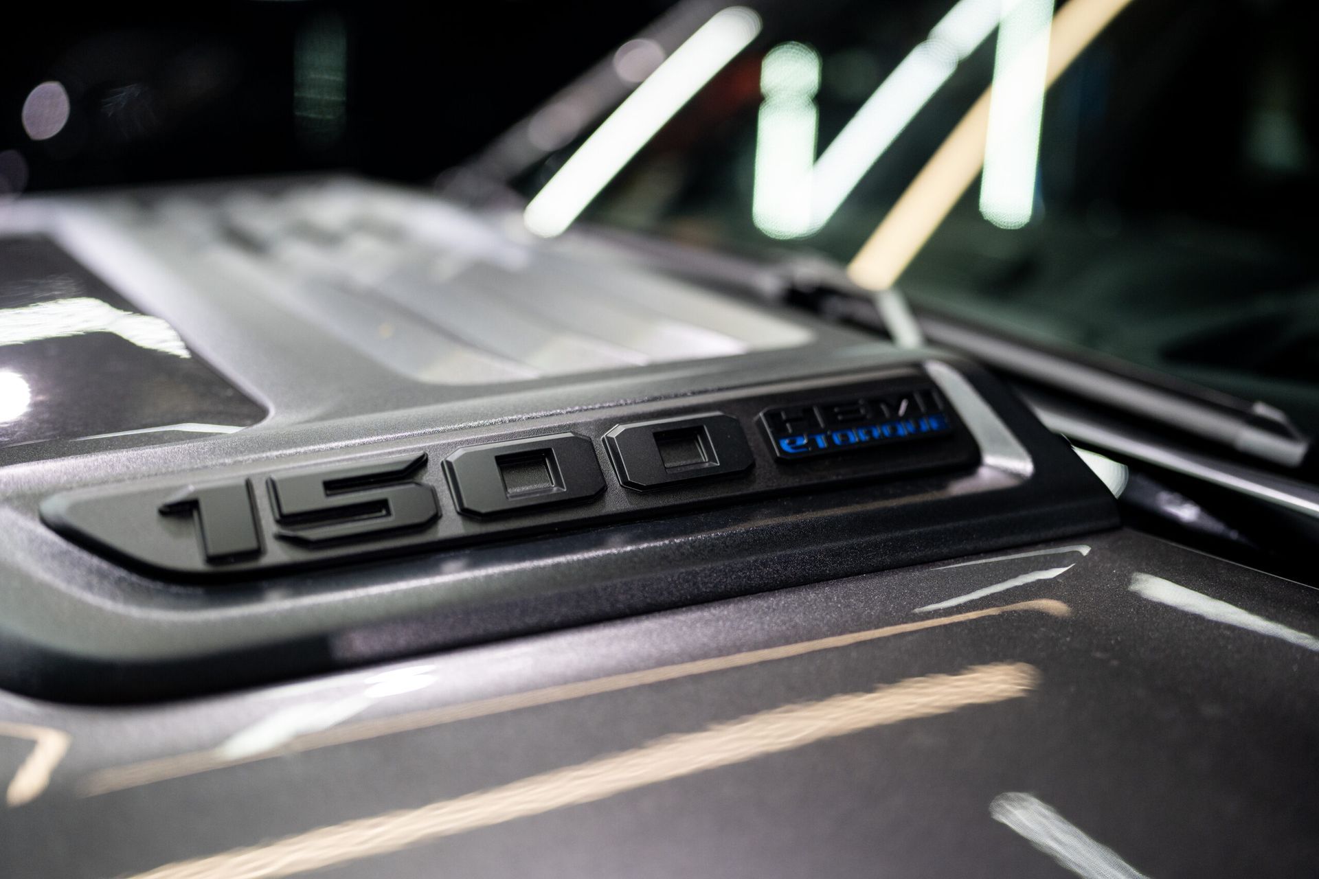 A close up of the hood of a ram 1500 truck.