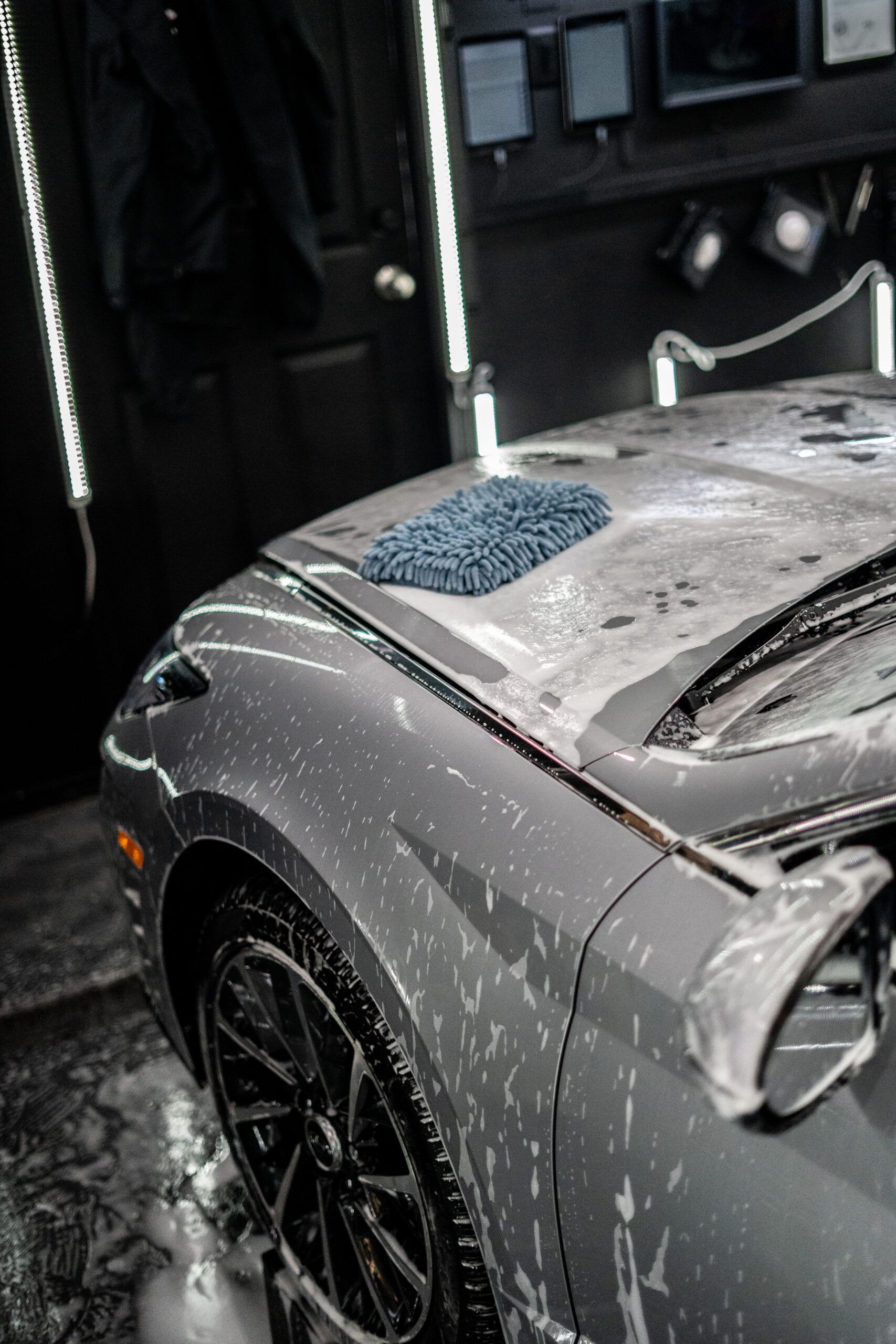 A car is being washed in a car wash.