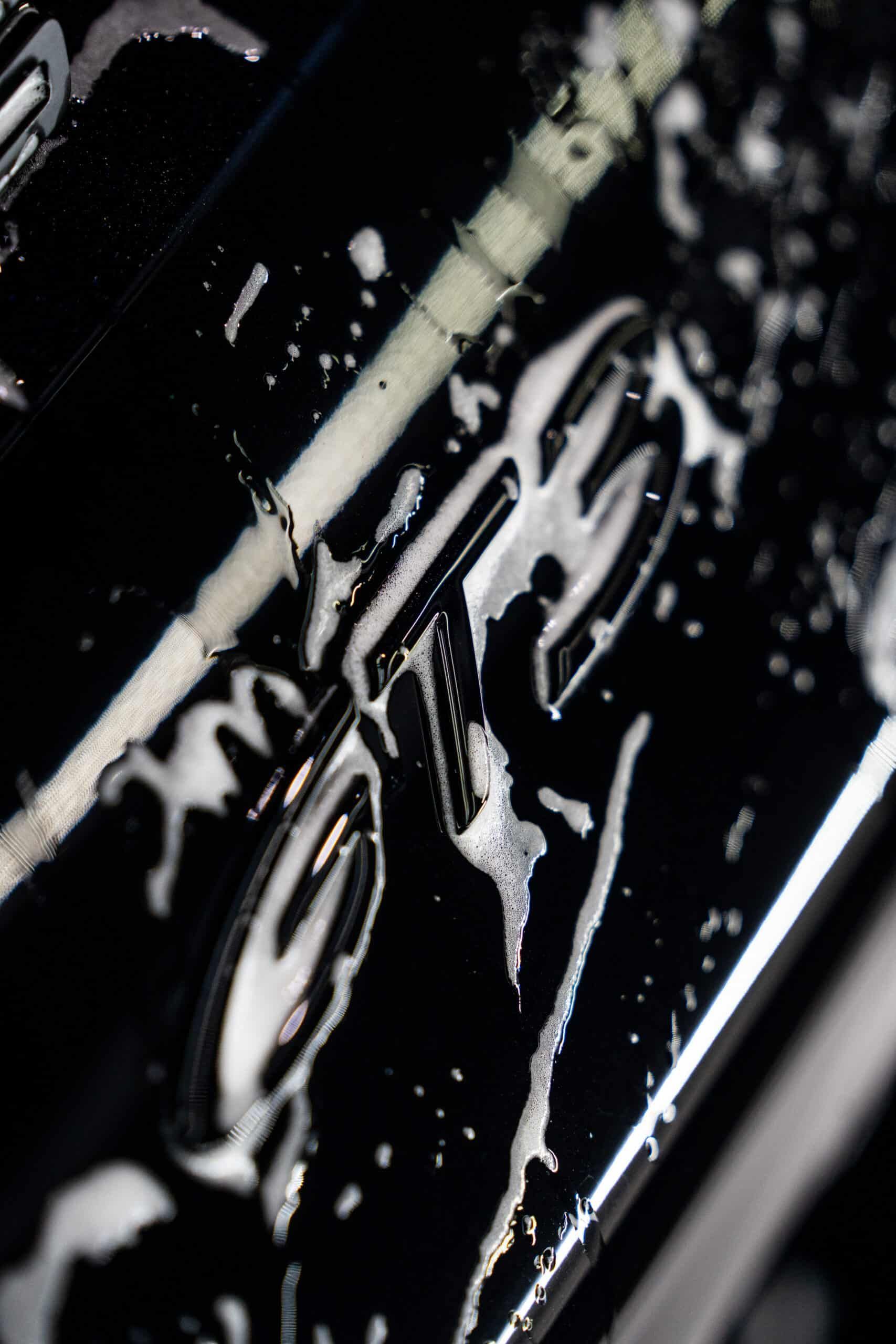 A close up of a black object with foam on it.