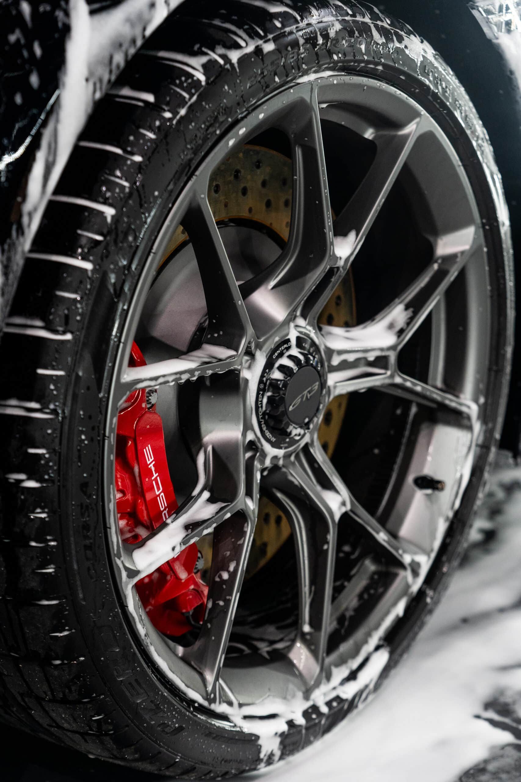 A close up of a car wheel with foam on it