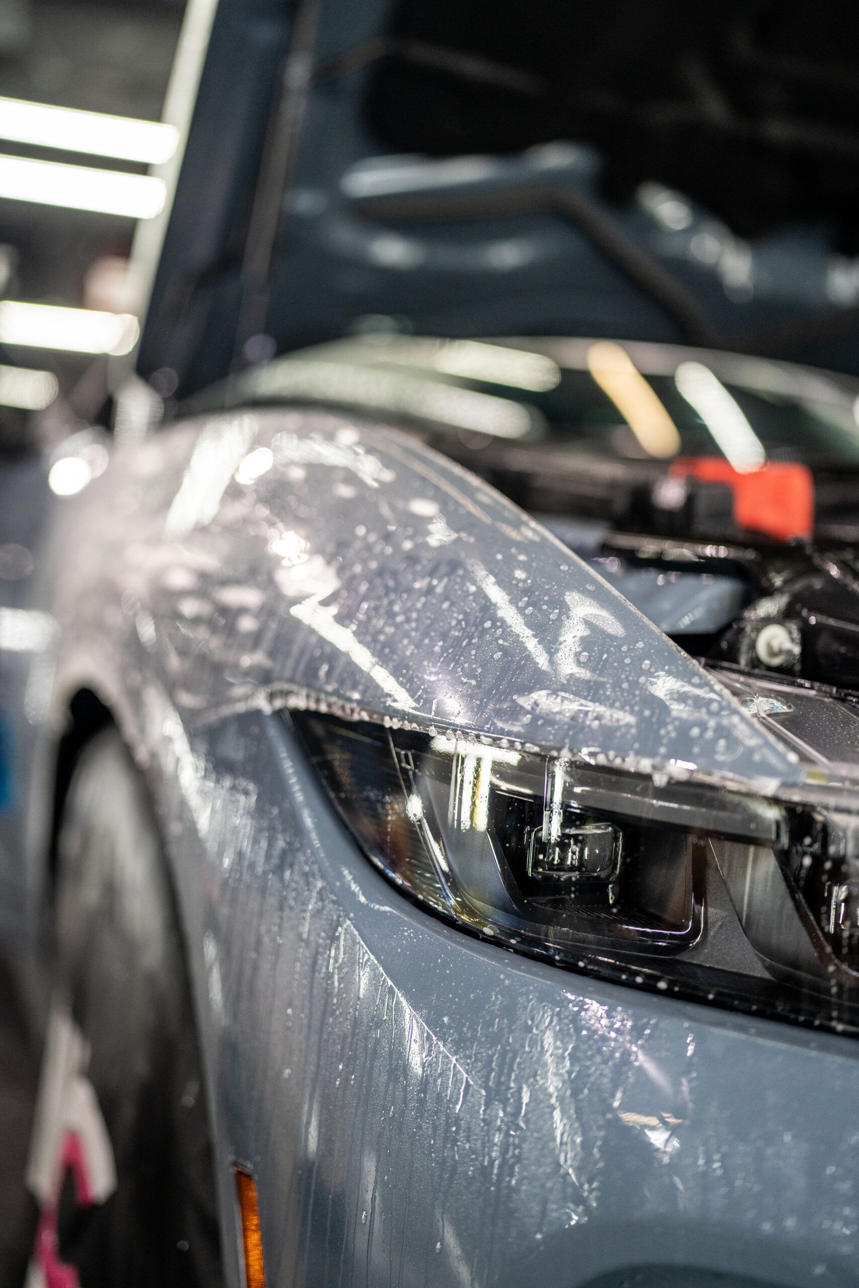 A close up of a car with the hood open.