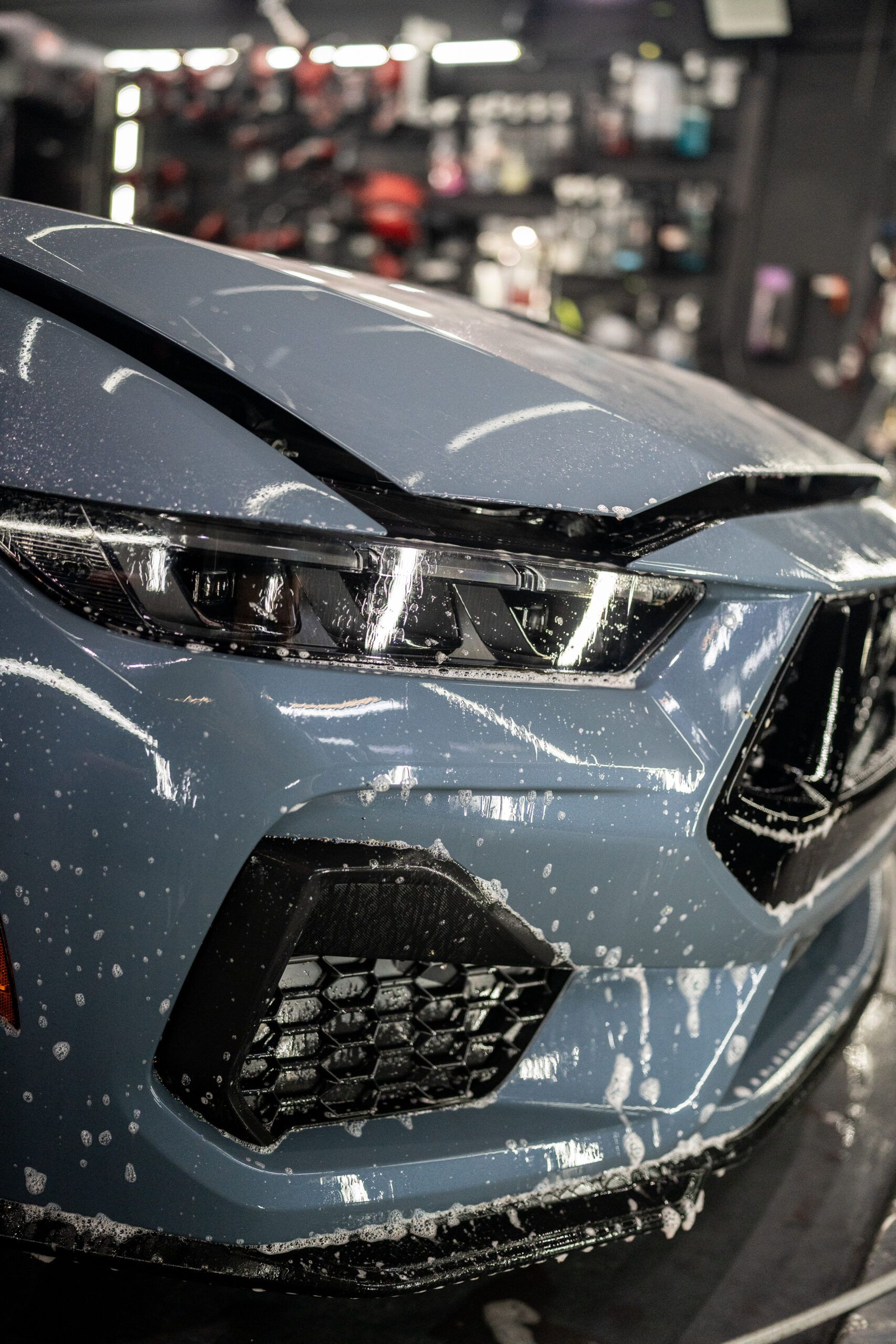 A close up of a car with a lot of dust on it.