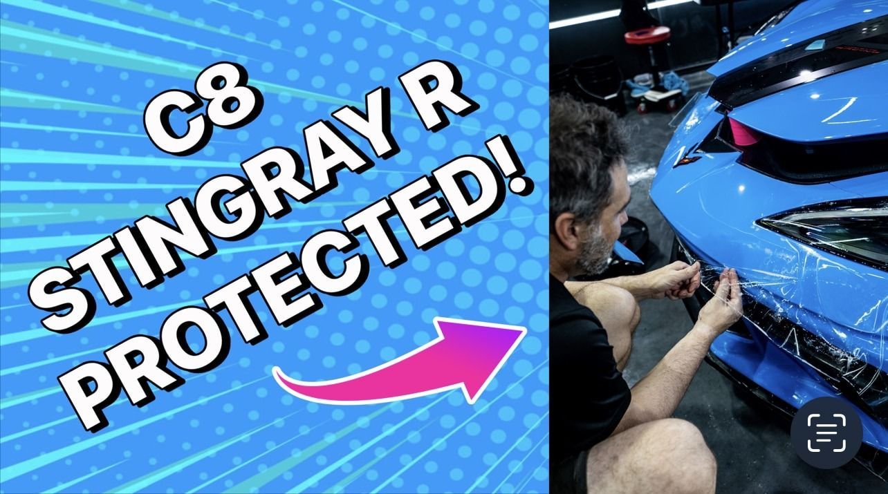 A man is wrapping a blue stingray r with plastic wrap.