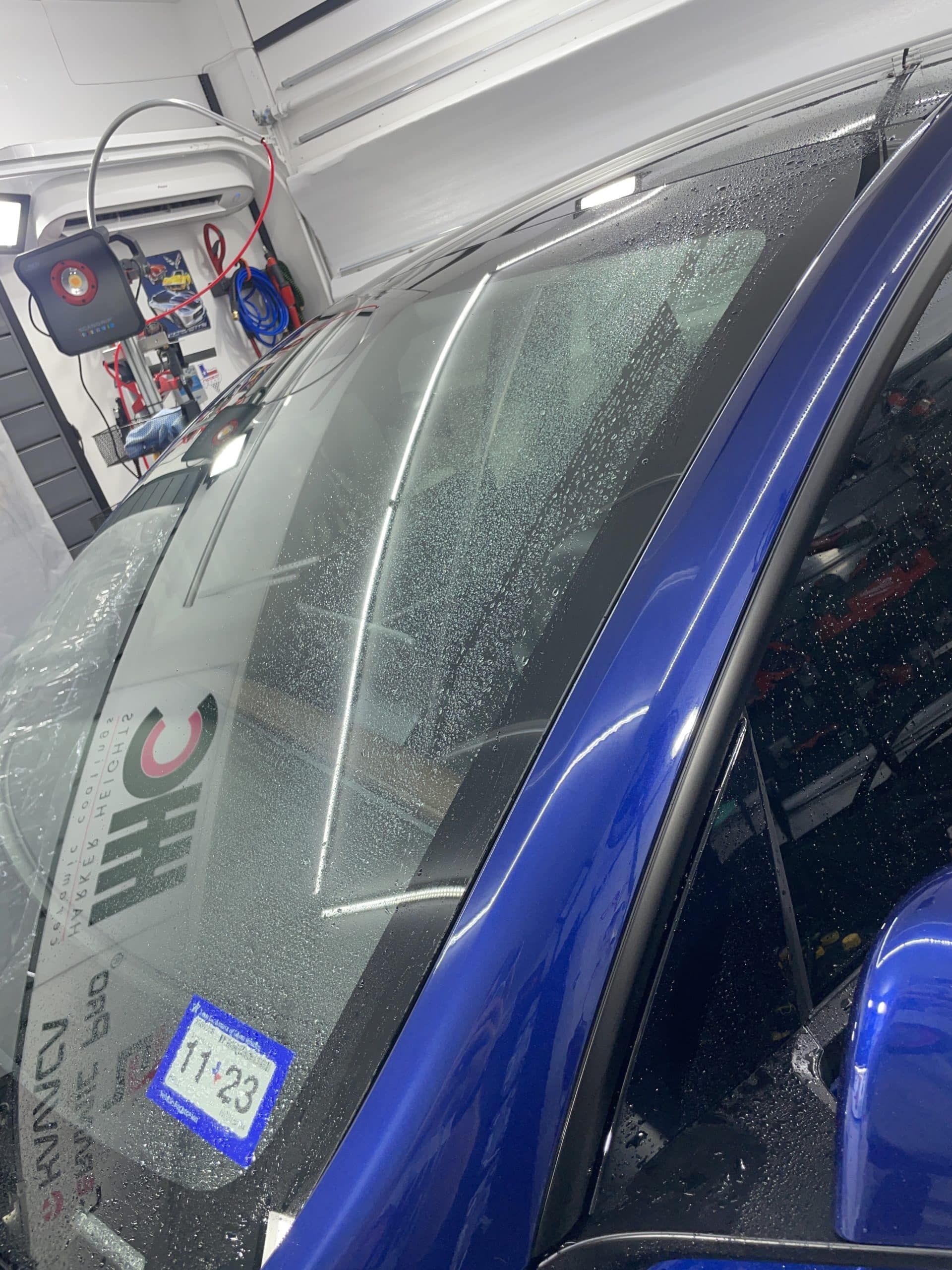 A blue car with a license plate that says 11-22