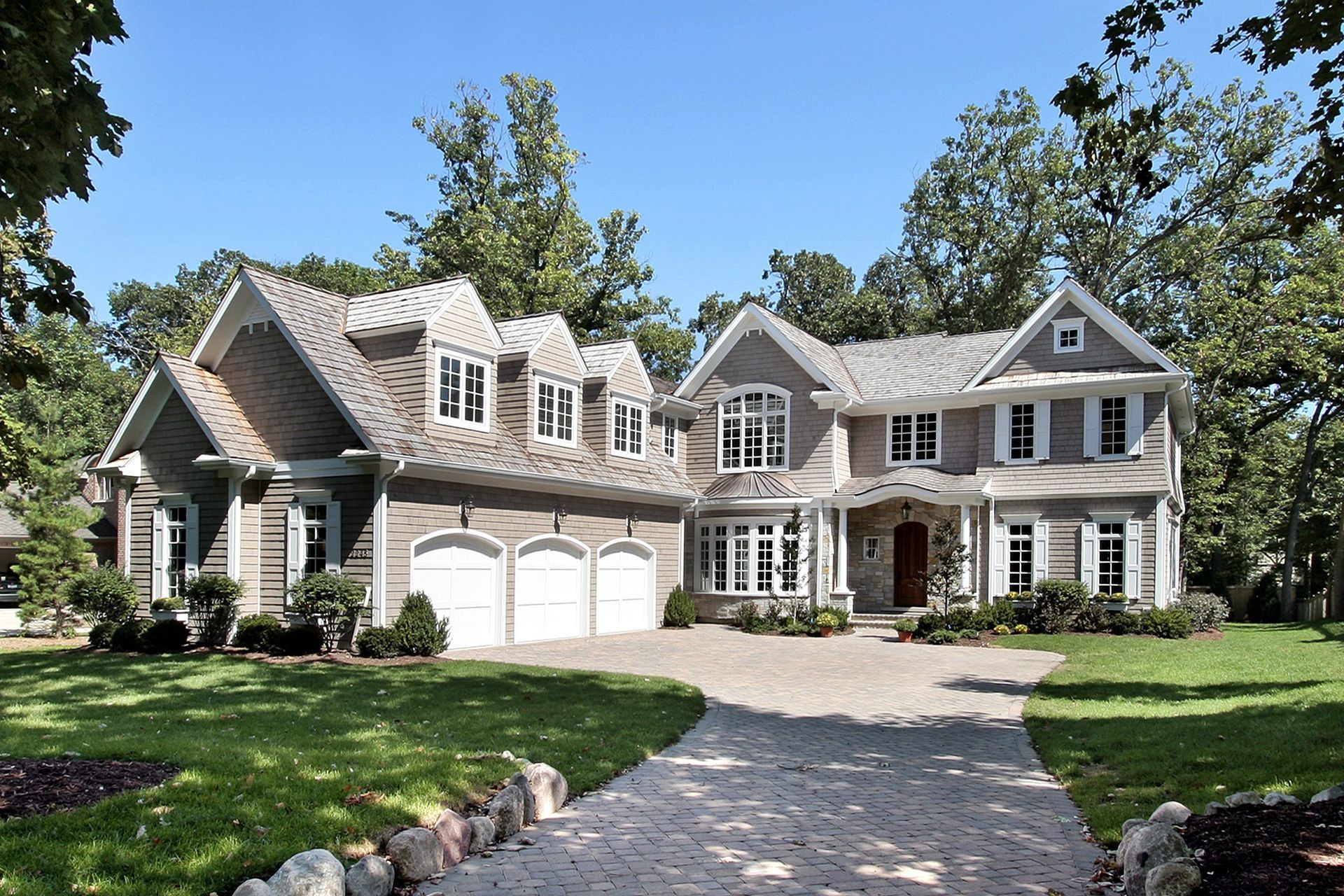 A large house with a lot of windows and balconies.