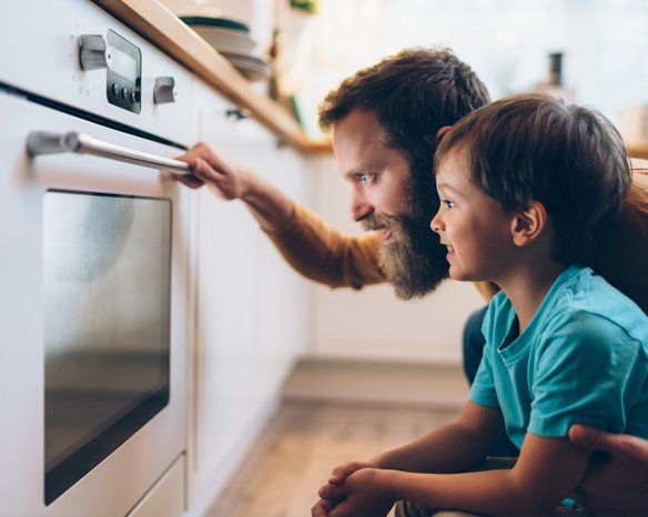 Father and Son Cooking Dinner — Jacksonville, FL — Appliance Doctors Father and Son Cooking Dinner — Jacksonville, FL — Appliance Doctors