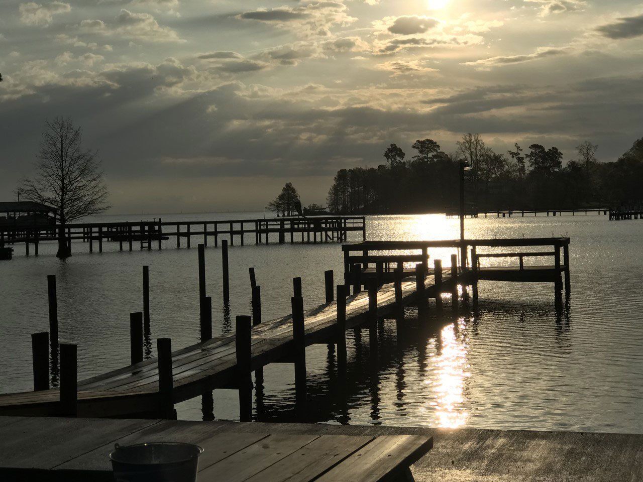 sun setting on the pier