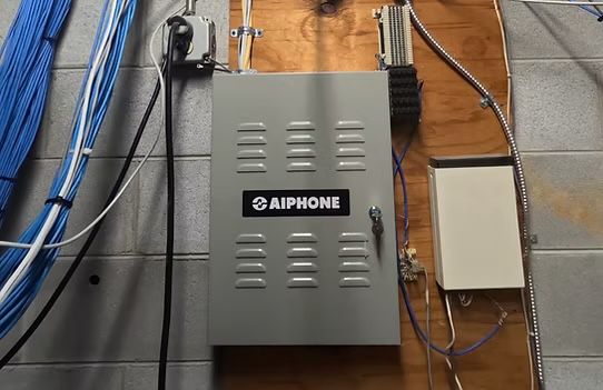 A metal box with the word aiphone on it