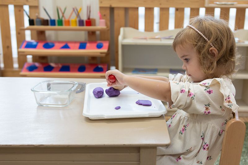 Montessori child working with Math materials