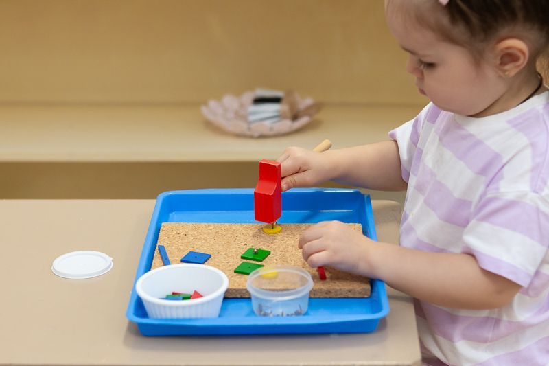 Montessori child working on practical life skills