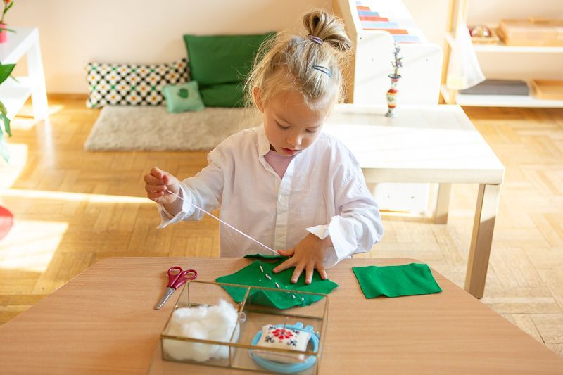 Montessori child working on practical life skills