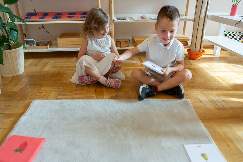 Montessori children working with language materials