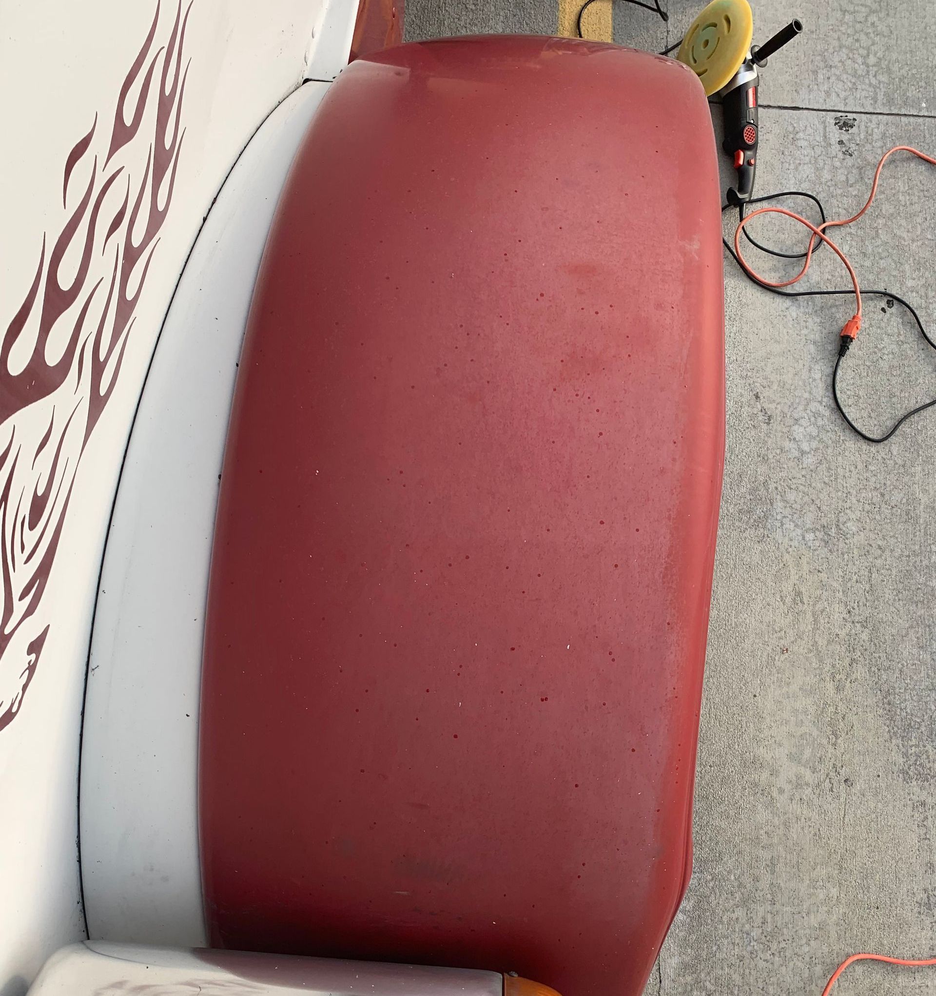 Red and white fender, with flames graphic.