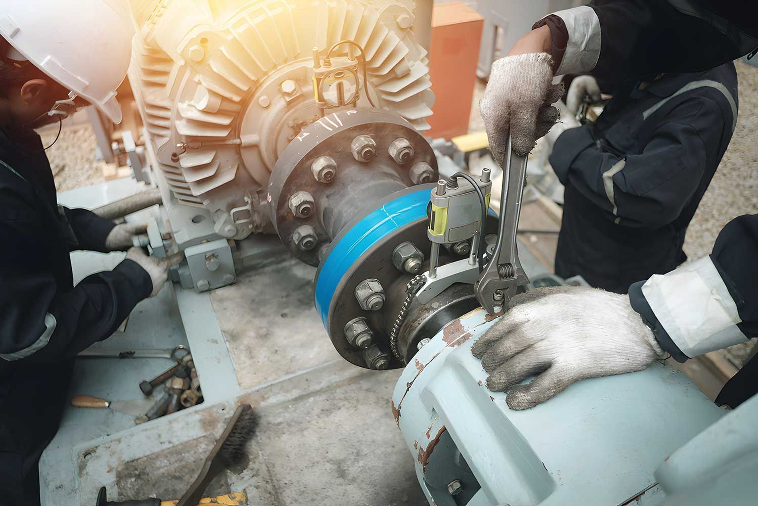 Mechanics in Work Attire Repair Large Industrial Machinery With Tools — Keyeng in Slade Point, QLD