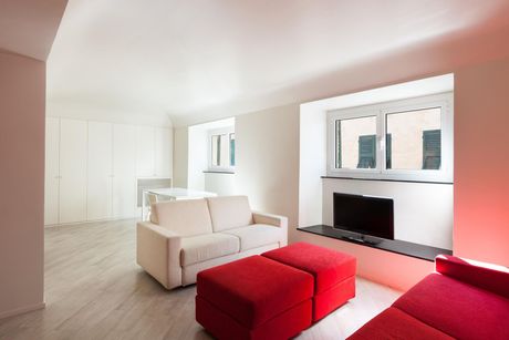 A living room with a white couch.