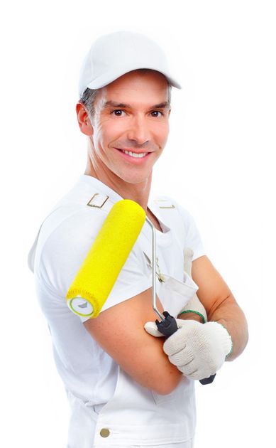 A man in a white shirt is holding a yellow paint roller.