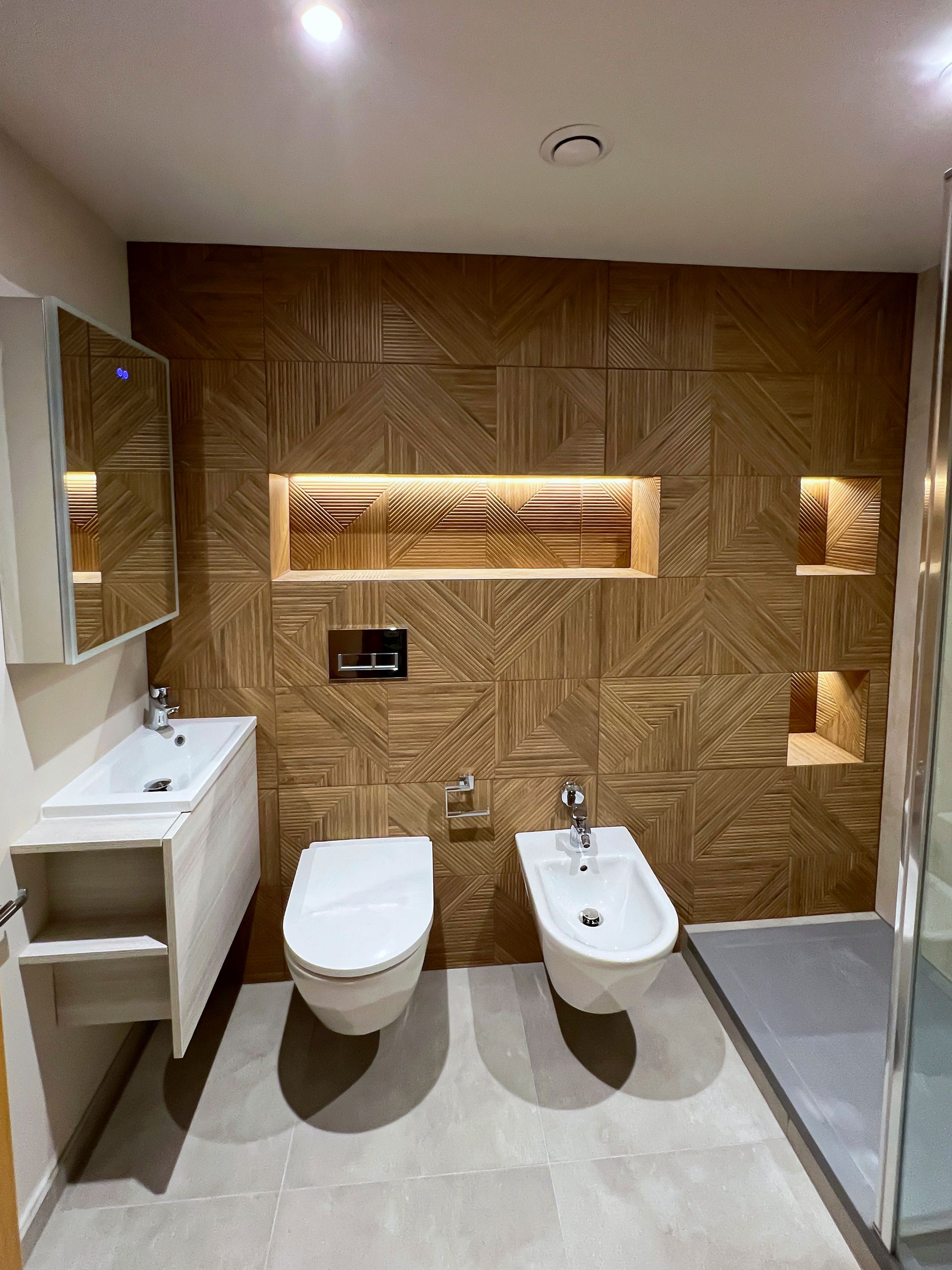 A bathroom with a toilet , sink , and bathtub.