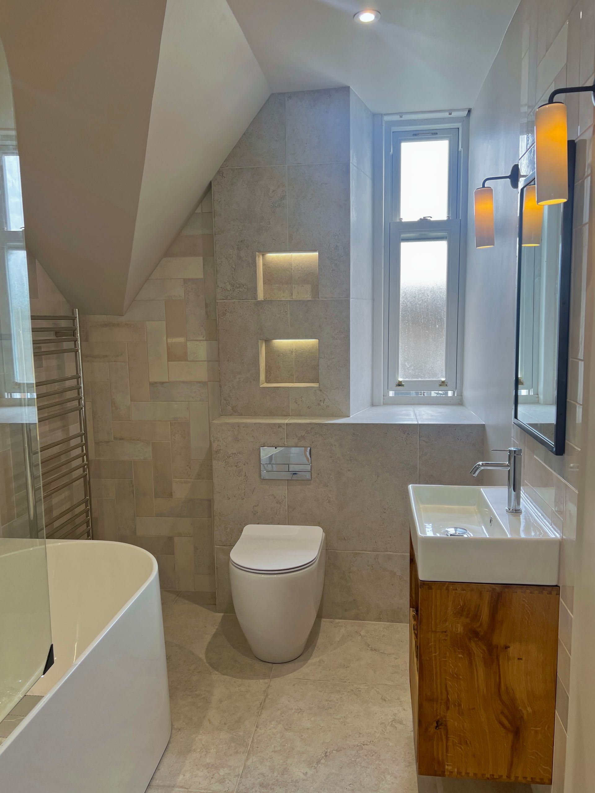 A bathroom with a toilet , sink , and bathtub.