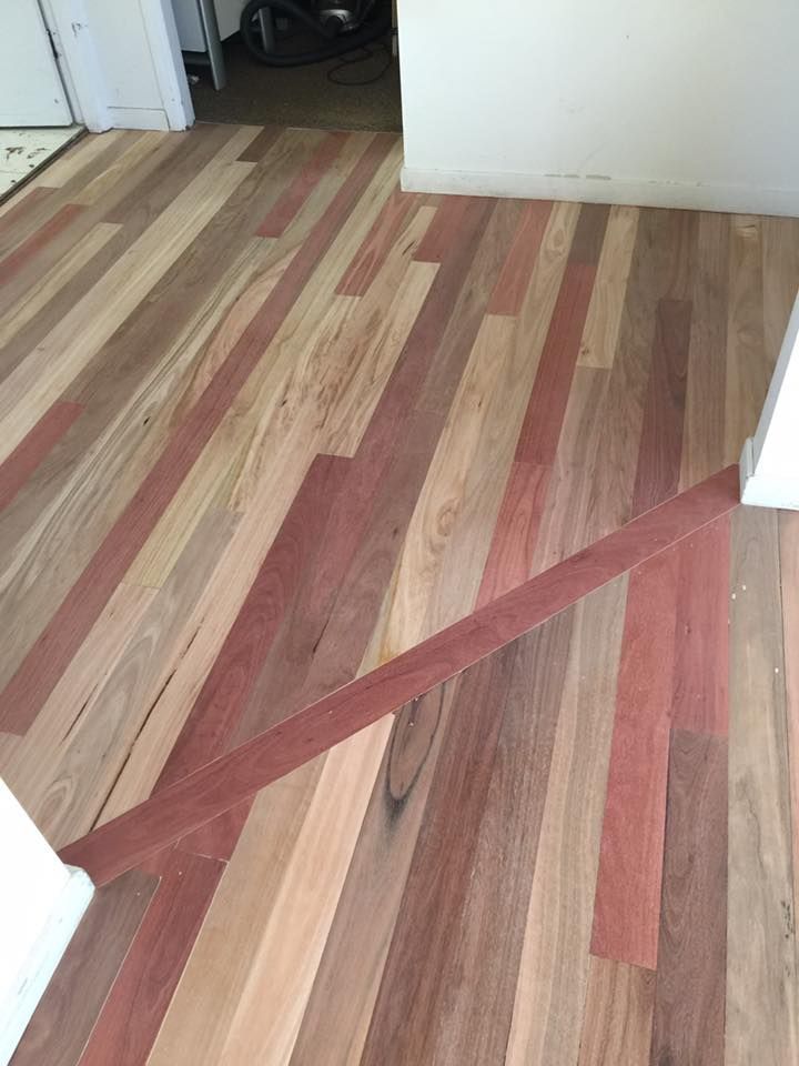 A Wooden Floor With A Striped Pattern In A Room — Byron Floor Sanding In Tintenbar, NSW