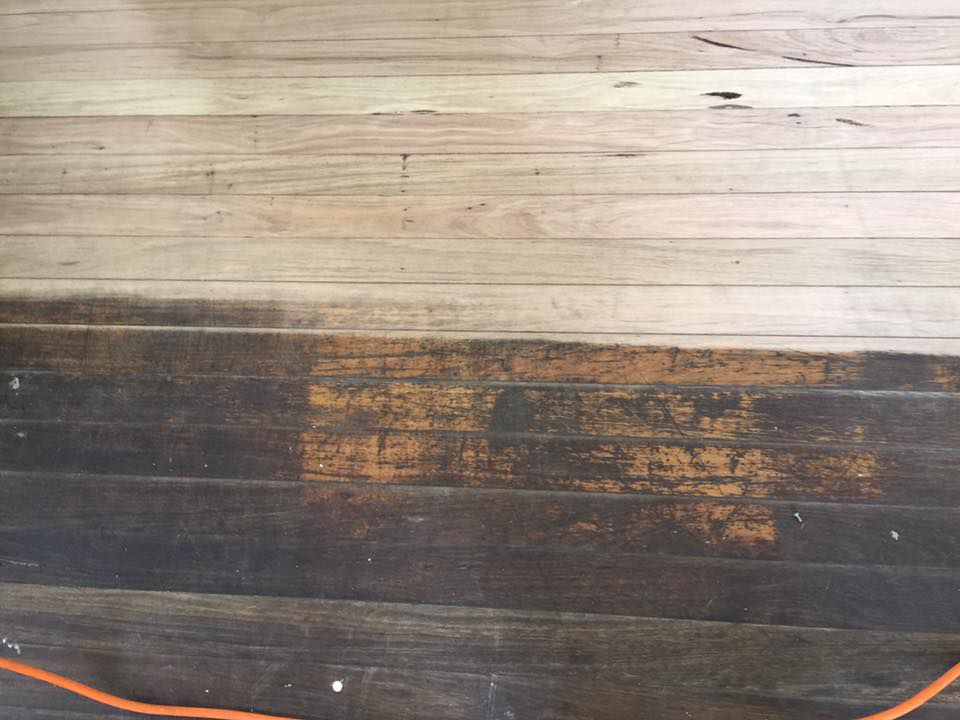 A Wooden Floor With A Hose Attached To It — Byron Floor Sanding In Yamba, NSW