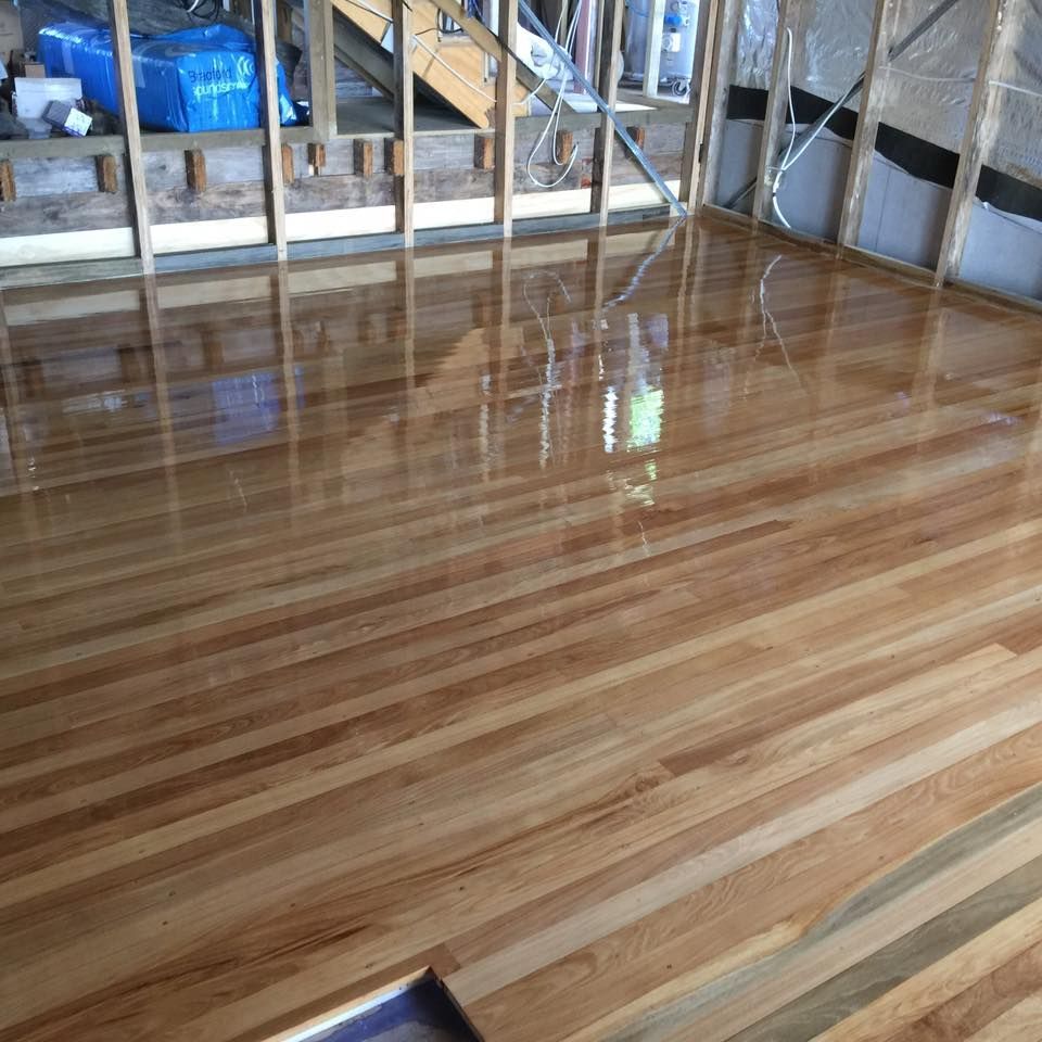 Newly Installed and Polished Hardwood Floor in A Room Under Construction — Byron Floor Sanding In Goonellabah, NSW