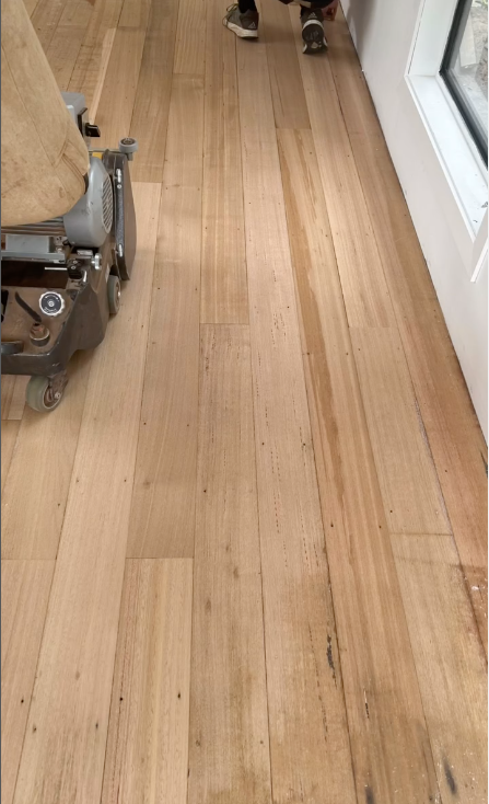 A Wooden Floor being Sanded With A Machine — Byron Floor Sanding In Alstonville, NSW