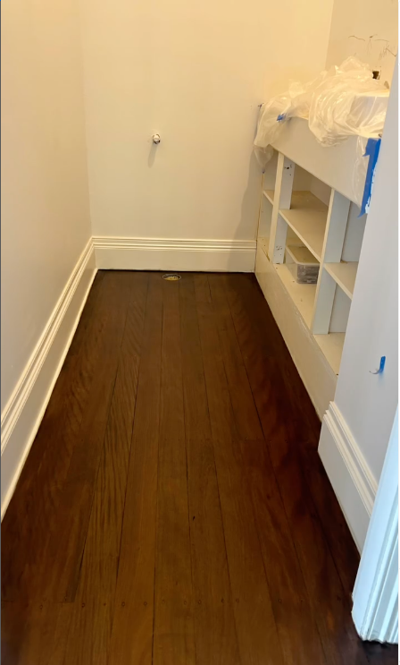 A Narrow Room With Dark Wood Flooring, White Trim, and Built-in White Shelves — Byron Floor Sanding In Alstonville, NSW
