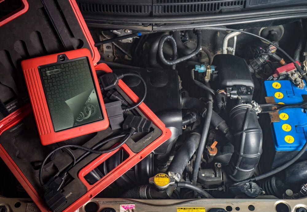 A Close Up of a Car Engine With a Diagnostic Tool — Steve's Service Centre in Albury, NSW 
