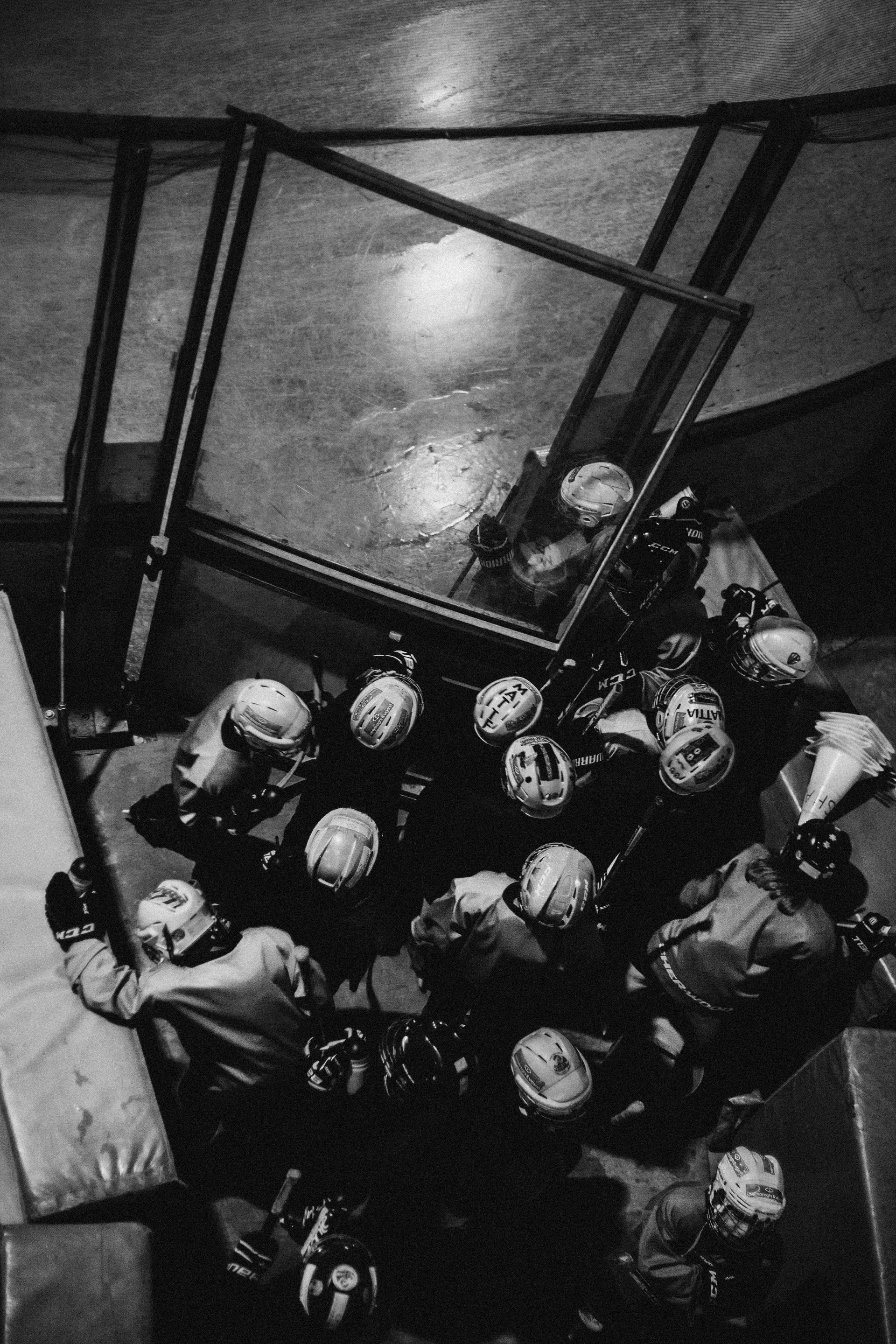 A black and white photo of a group of hockey players