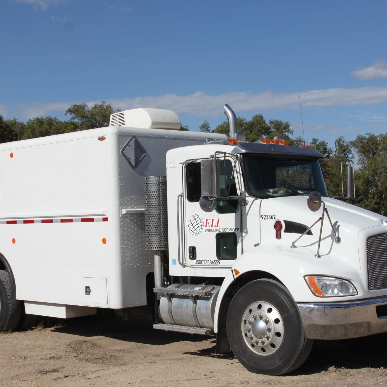 A white truck with the word ELI on the door