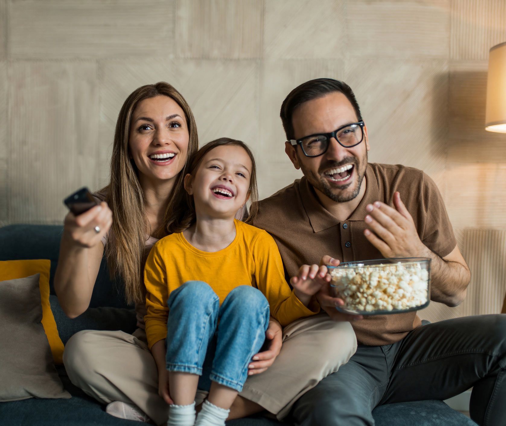 Happy young family watching TV | Shoalhaven, NSW | Shoalhaven Antennas