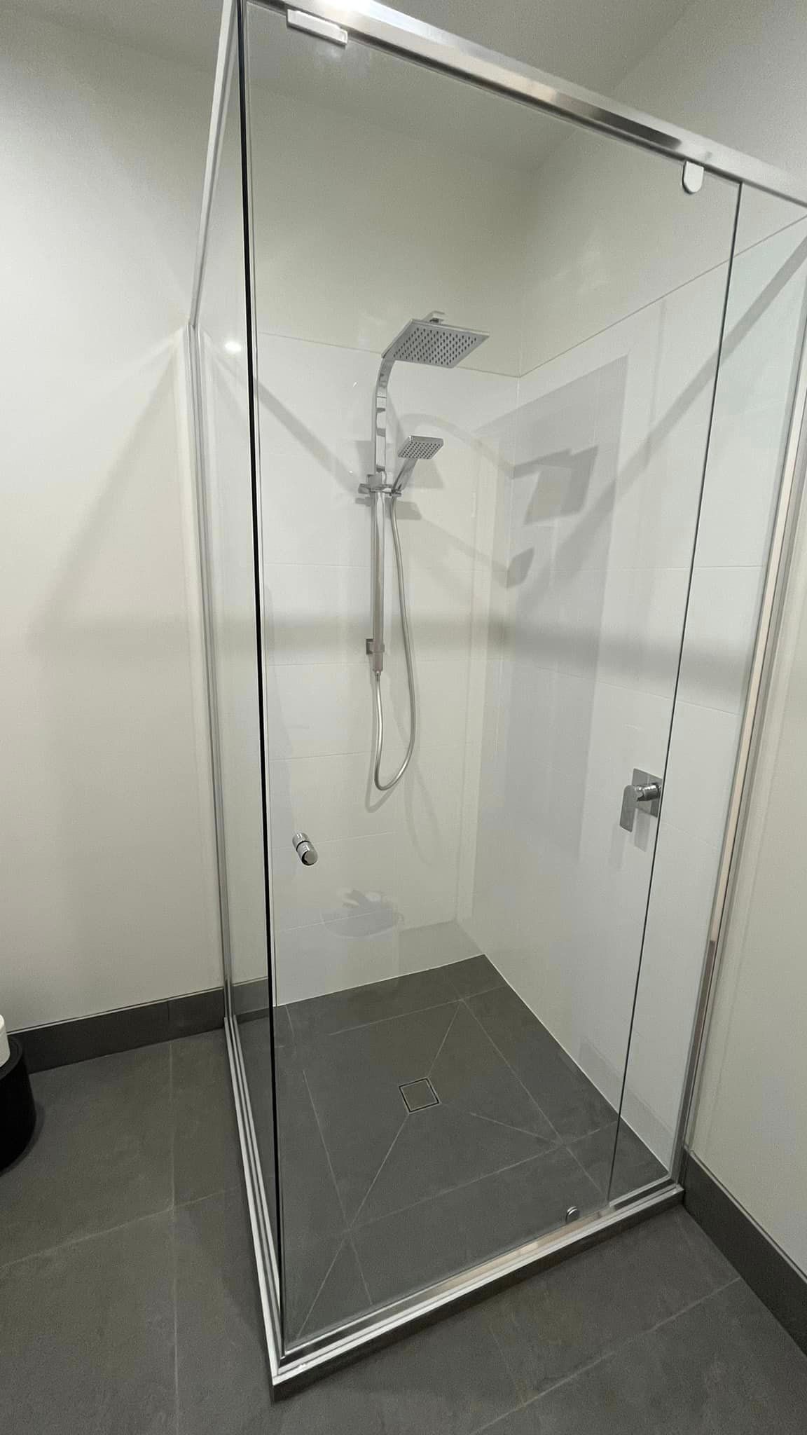 Bathroom With Glass Shower Door And Square Shower Tap — SC Glass & Aluminium in Yandina, QLD