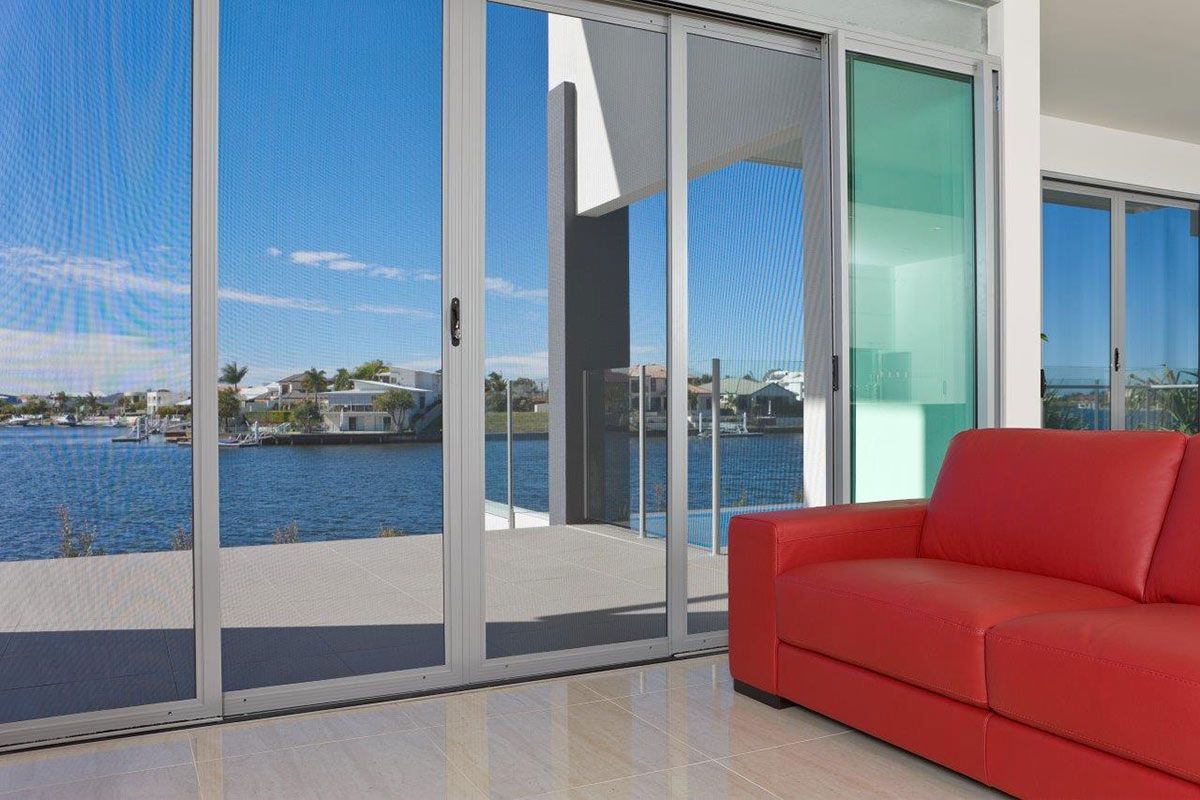A Person Opening The Window With Screen — SC Glass & Aluminium in Yandina, QLD