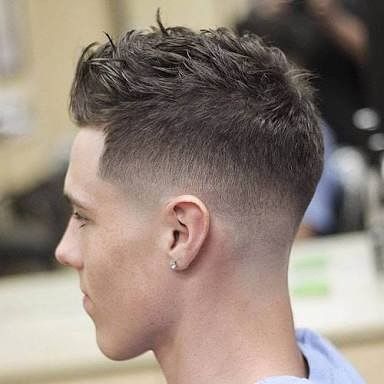 A Man Is Getting His Hair Cut At A Salon — Minnie & Lucille Hairdressing In Armidale, NSW