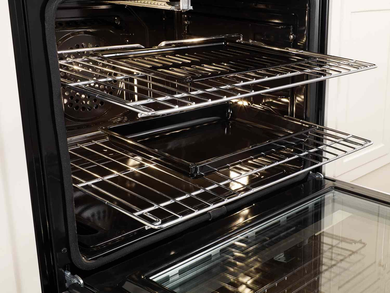 Gulf Shores grill cleaning experts removing grease and food residue with oven cleaning service