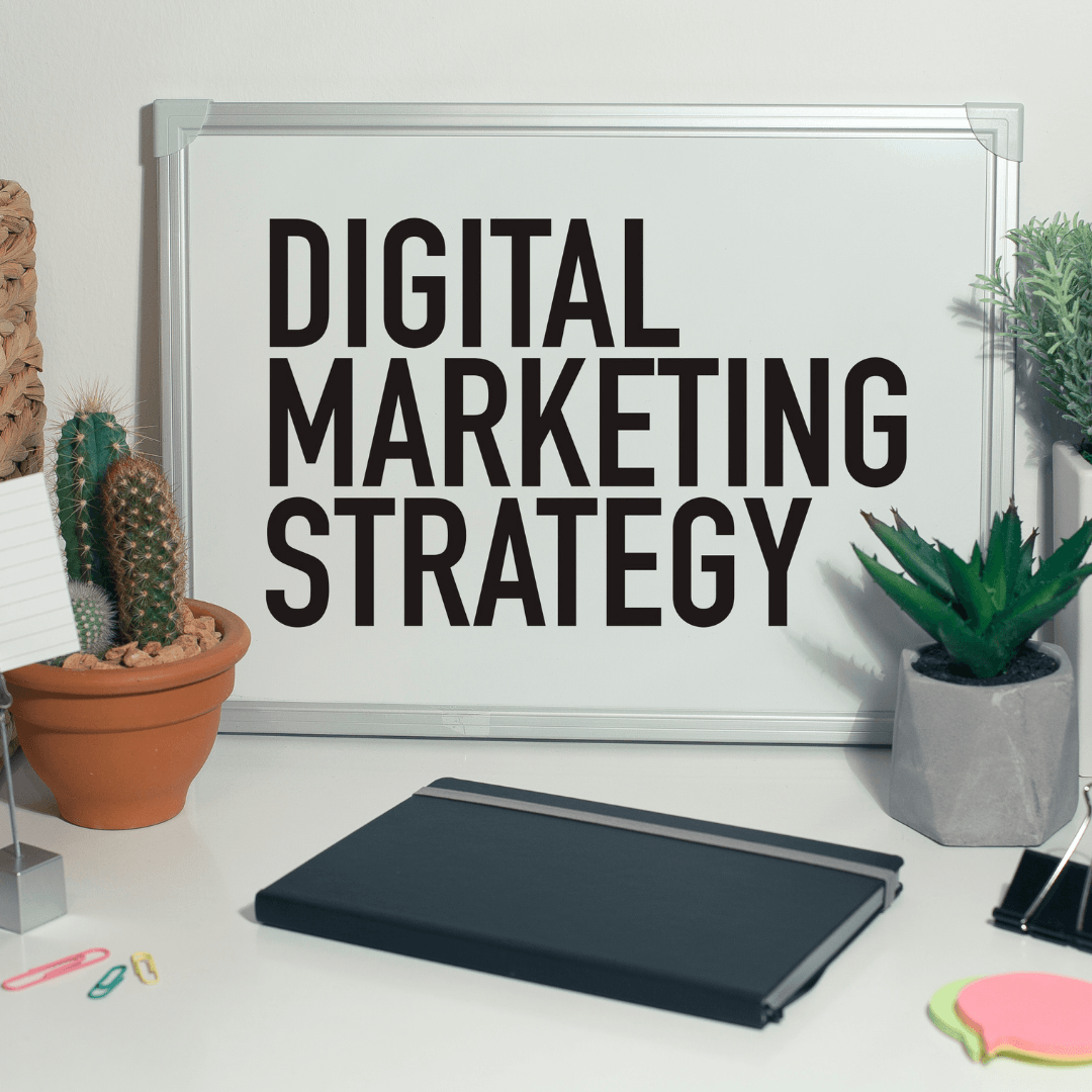 Office with some plants on the sides an a poster that says digital marketing strategy