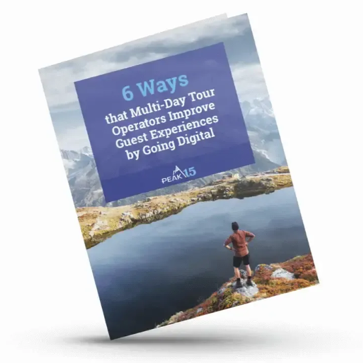 Tilted blue guidebook cover titled “6 Ways that Multi-Day Tour Operators Improve Guest Experiences by Going Digital”