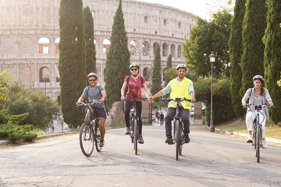 group of people riding bikes in the day