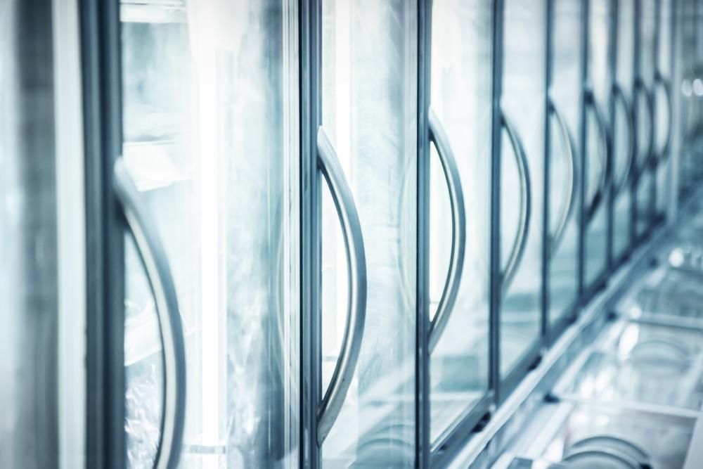 A Row of Refrigerators With Glass Doors in a Store — Atmosphere Air Conditioning & Refrigeration In Taylors Beach, NSW